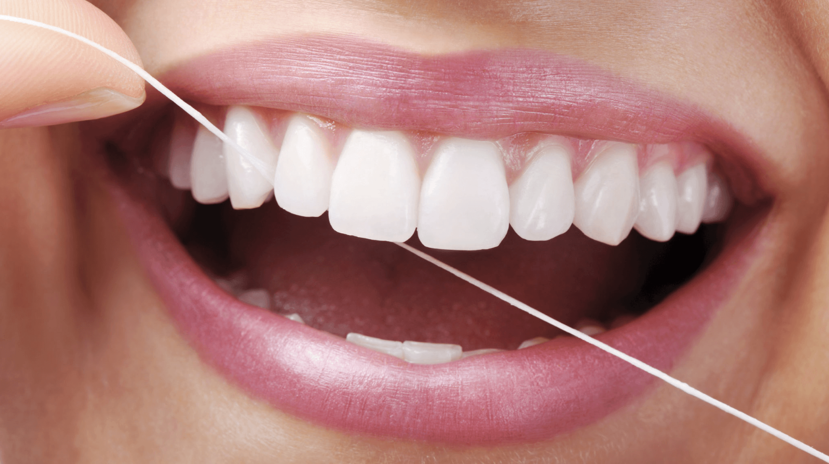 Dental tape and flossers compared side by side